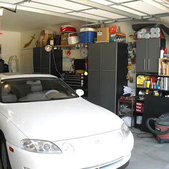 Organized garage with storage cabinets and white car - Harold from Prescott, AZ