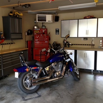 Organized garage with metal cabinets and motorcycle - Regan from Alberta, Canada