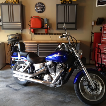 Organized garage with motorcycle and tool cabinets - Regan from Alberta, Canada