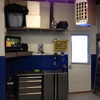 Organized garage workspace with cabinets and pegboard - Jeremy from Firestone, CO