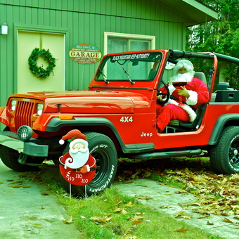 Red Jeep Wrangler with Christmas Decor at Garage - Big Greg