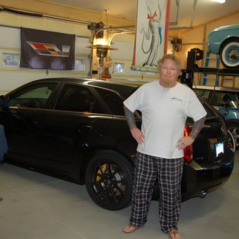 Custom garage with car lift and banners - Paul Nolte from Okemos, MI
