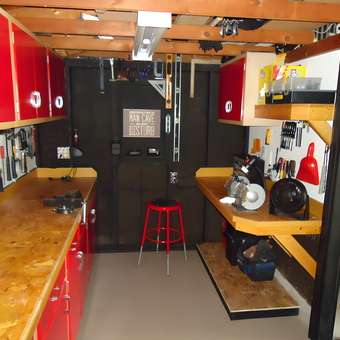 Organized garage with red cabinets, workbenches, and tools - Dave from Jackson, MI