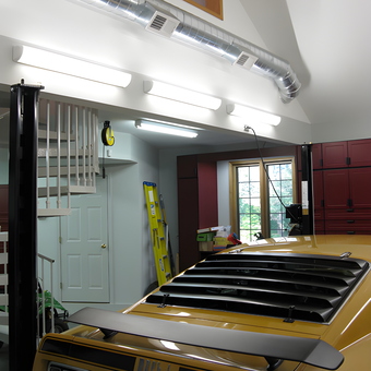 Well-Lit Garage with Storage Cabinets and Car Lift - T. from New Lenox, IL