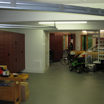 Spacious garage with red cabinets and workbench - T. from New Lenox, IL
