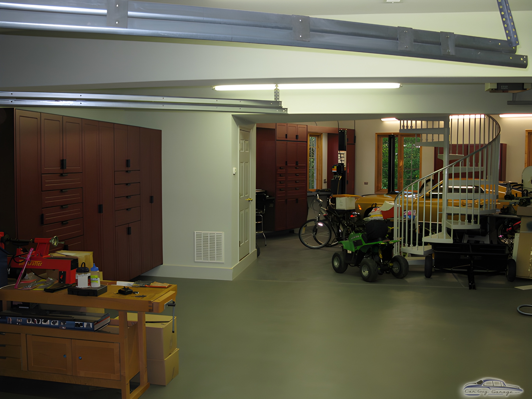 Spacious garage with red cabinets and workbench - T. from New Lenox, IL