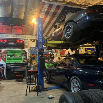 Car Lift, Tool Chests, and Decor in Dusty Garage - Dusty garage from Madison, OH