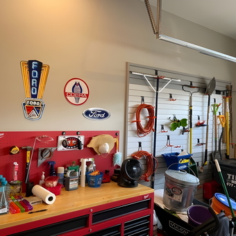 Organized garage with slatwall storage and Ford signs - Mike from Zion Crossroads, VA