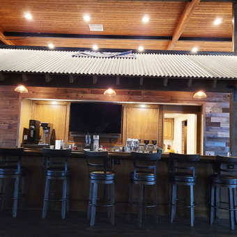 Rustic garage bar with wood stools and TV - Jack from Temecula, CA