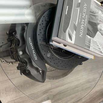 Aston Martin Brake Rotor Glass Table with Books - Rulo from San Antonio, TX