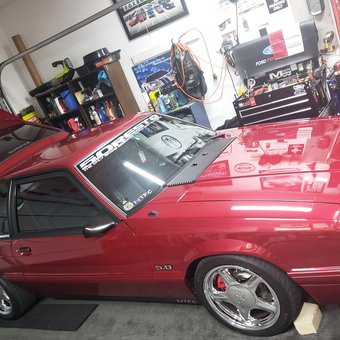 Organized garage with red Mustang and tool chests - Chris from Denton, TX