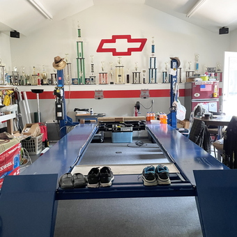 Chevy Garage With Car Lift and Trophies Display - Denny from North Liberty, IA