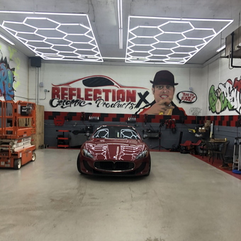 Modern garage with Maserati, LED lights, wall art - The Godfather from Peabody, MA