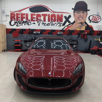 Luxury Garage with Red Maserati and Wall Art - The Godfather from Peabody, MA