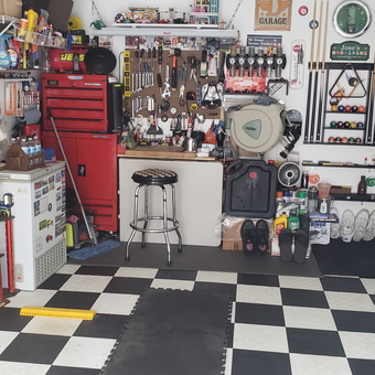 Organized garage with tool chest, trophies, and decor - Jose from Staten Island, NY