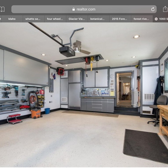 Organized garage with cabinets, workbench, and tool storage - Jerry from ID