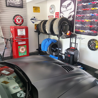 Corvette Decor, Tire Rack, and Vintage Pump in Garage - Angelo