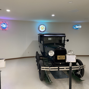 Vintage Car Display with Neon Garage Signs - Debra from Perham, MN