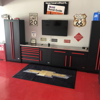 Red and Black Garage Cabinets with Wall Decor - Geo Garage from Wentzville, MO