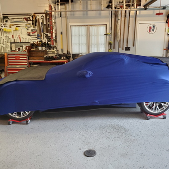 Organized garage with car cover, wheel dollies, and tool storage - Jim from Grand Haven, MI