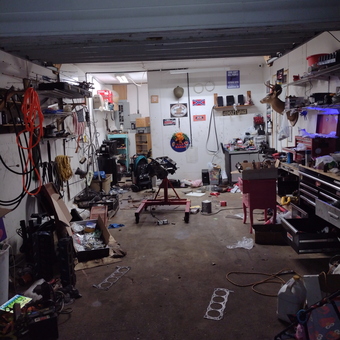 Organized garage with tools, engine stand, and storage - John from Vinemont, AL