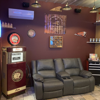 Indian Motorcycle Decor Garage with Leather Sofa - Wag from Larned, KS