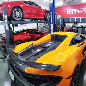 Exotic car garage with lift, tool cabinets, and Ferrari sign - Mike from Joplin, MO