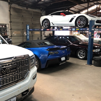 Organized garage with car lift, Corvettes, GMC truck - VJ from Booker, TX