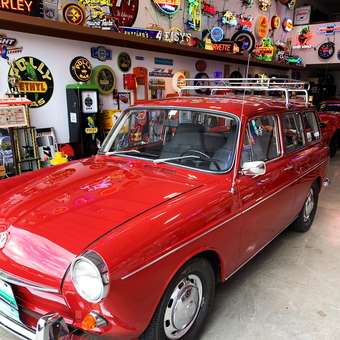 Classic Garage With Neon Signs and Red VW Wagon - Neon Leon from Canal Winchester