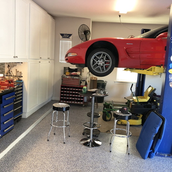Organized garage with car lift, tool chests, and stools - David from Georgetown, TX