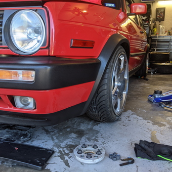 Red Car with Tools, Floor Jack, and Tire in Garage - CJ from North Richland Hills, TX