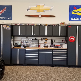 Modern garage with black cabinets and workbench - Bill from Oyster Bay, NY