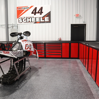 Red Garage Cabinets and Workbench with Snowmobile - All Finish Racing