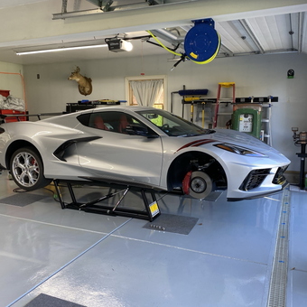 Modern garage with car lift and storage cabinets - DogMan816 from East Aurora, NY