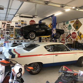 Classic Cars, Wall Signs, and Auto Lift in Garage - Chris from Hauser, ID
