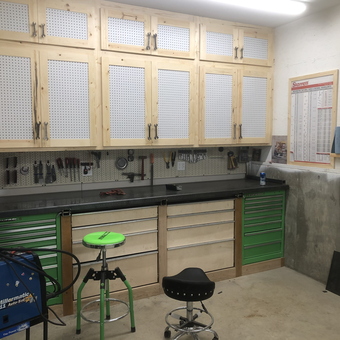Organized garage workspace with green tool cabinets - Chris from Hauser, ID