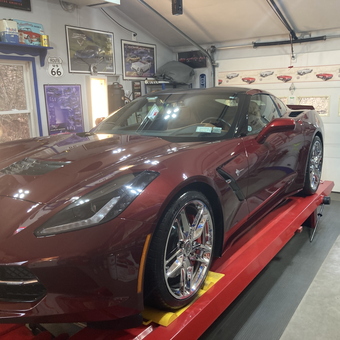 Corvette on Red Lift with Garage Decor - Dick from NY
