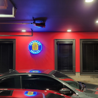 Red garage with Cadillac neon sign and car wall art - Stephen from Big Canoe, GA