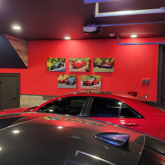 Modern garage with red accent wall and car art - Stephen from Big Canoe, GA