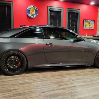 Modern garage with Cadillac decor and custom flooring - Stephen from Big Canoe, GA