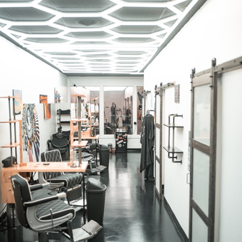 Modern garage with barber chairs and wall shelving - ProForm Cut & Shave from Colorado springs, CO