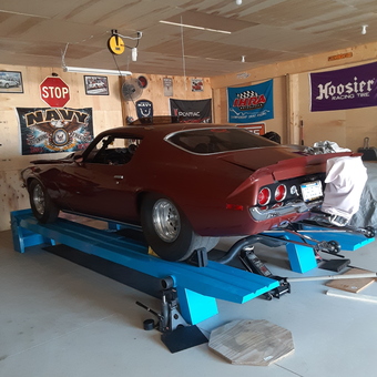 Classic muscle car on blue car lift in garage - Greg from Coopersville, MI