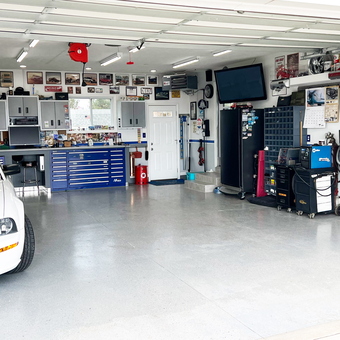 Organized garage with workbench, tool cabinets, and Mustang - Gary from Divernon, IL
