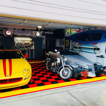 Custom garage with checkered floor, cars, and storage - Mahaff from Houston, TX