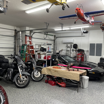 Organized garage with motorcycles, Corvette, ladders, and tools - Bob from Hobe Sound, NJ