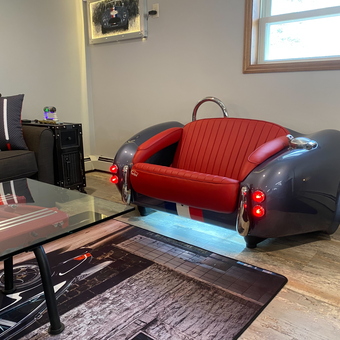 Classic Car Couch and Ferrari Decor in Garage Lounge - Kevin