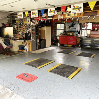 Organized garage with tool chests and car ramps - John from Chicopee