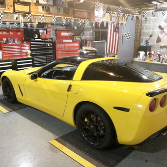 Organized garage with yellow Corvette and tool chests - John from Chicopee
