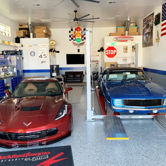 Custom garage with car lift, cabinets, and decor - Dave from Mesa, AZ