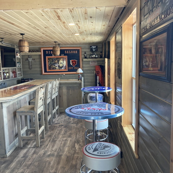 Rustic Garage Bar with Branded Tables and Stools - Mike Griego from Las Vegas, NM